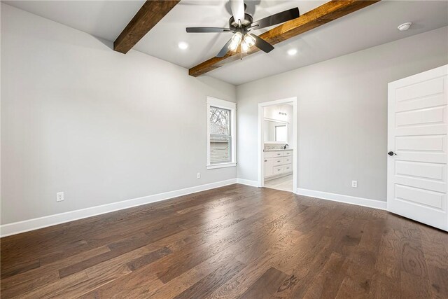 unfurnished bedroom featuring beam ceiling, recessed lighting, connected bathroom, wood finished floors, and baseboards