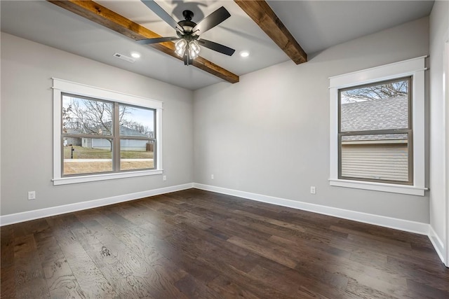 unfurnished room featuring beam ceiling, visible vents, and baseboards