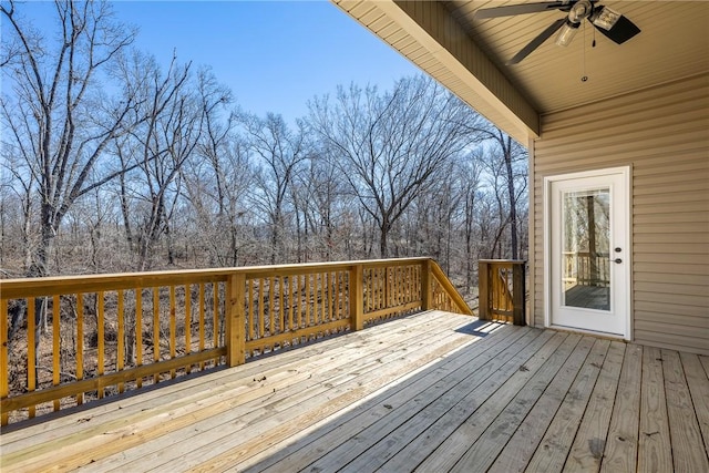 wooden deck featuring a ceiling fan