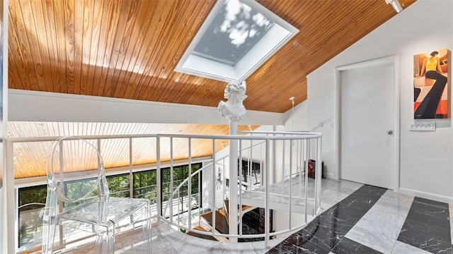 hallway featuring wood ceiling and vaulted ceiling