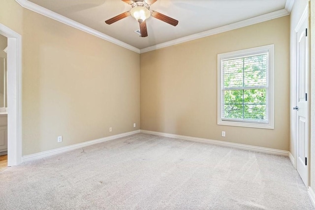 empty room with light carpet, crown molding, and ceiling fan