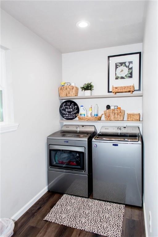 clothes washing area with washing machine and dryer, recessed lighting, laundry area, dark wood-type flooring, and baseboards