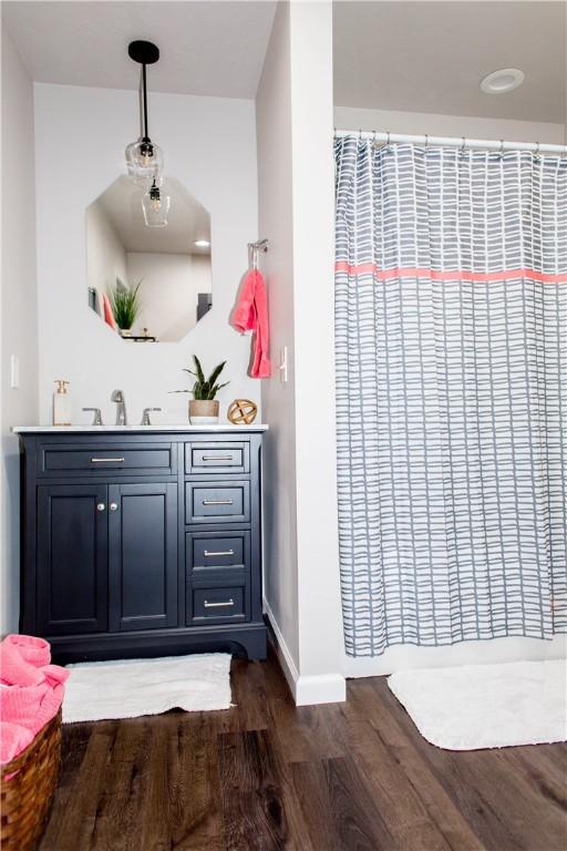 bathroom featuring vanity and wood-type flooring