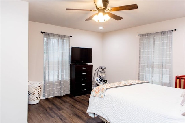 bedroom with dark wood-style floors and ceiling fan