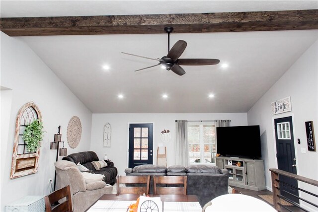 living room with hardwood / wood-style flooring, lofted ceiling with beams, and ceiling fan