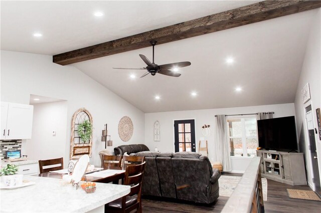 living room featuring high vaulted ceiling, beamed ceiling, dark hardwood / wood-style floors, and ceiling fan