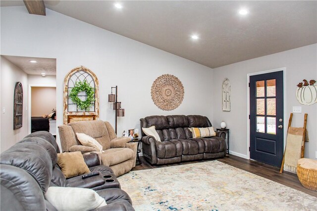 living room with vaulted ceiling with beams and dark hardwood / wood-style floors