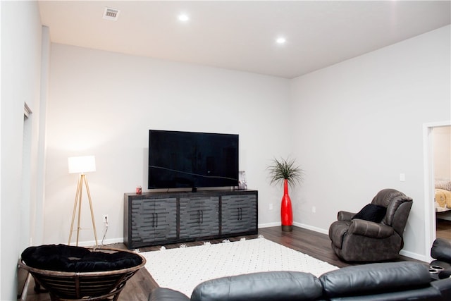 living room featuring dark hardwood / wood-style flooring