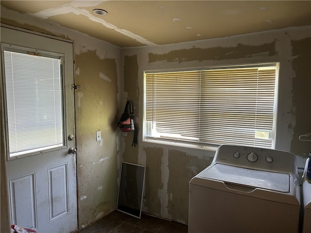 clothes washing area featuring a wealth of natural light and washer / clothes dryer