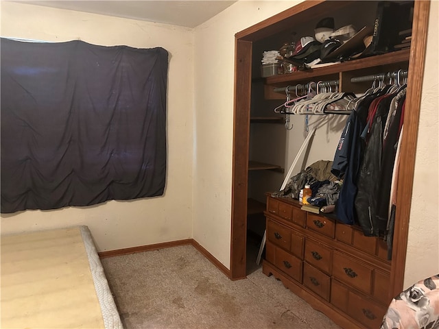 carpeted bedroom featuring a closet