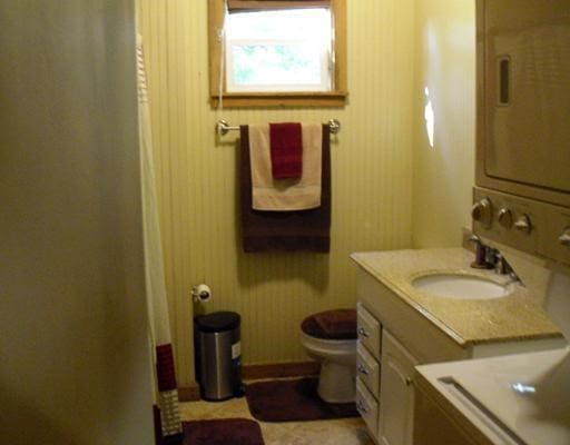 bathroom featuring vanity and toilet