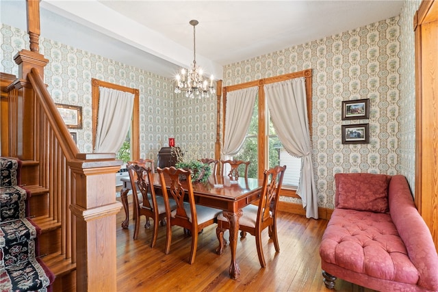 dining area featuring an inviting chandelier and wood-type flooring