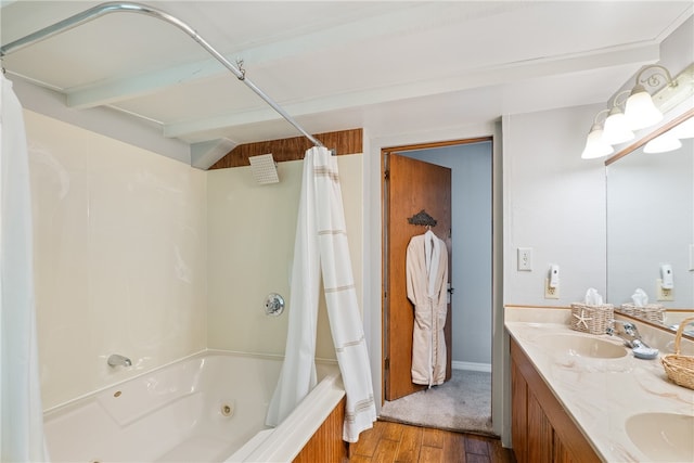 bathroom with shower / bath combo with shower curtain, hardwood / wood-style floors, and double sink vanity