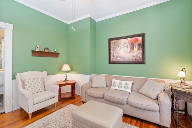 living room with ornamental molding and hardwood / wood-style floors