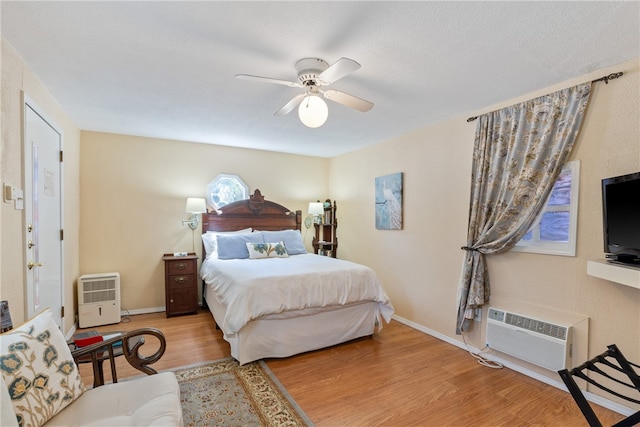 bedroom featuring light wood-type flooring and ceiling fan