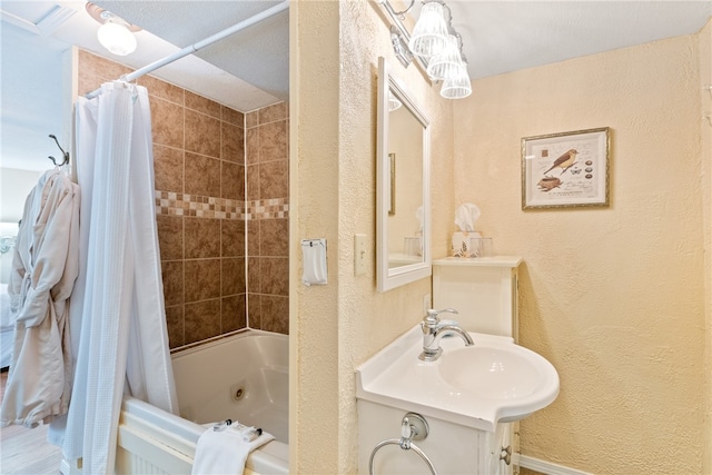 bathroom featuring vanity and shower / tub combo with curtain