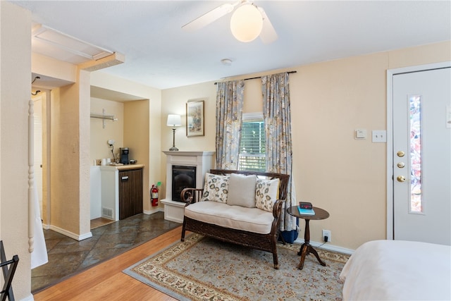 sitting room featuring hardwood / wood-style flooring and ceiling fan