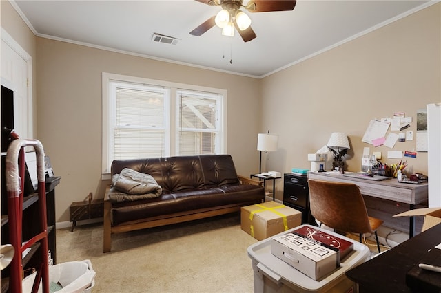 carpeted office space with ornamental molding and ceiling fan