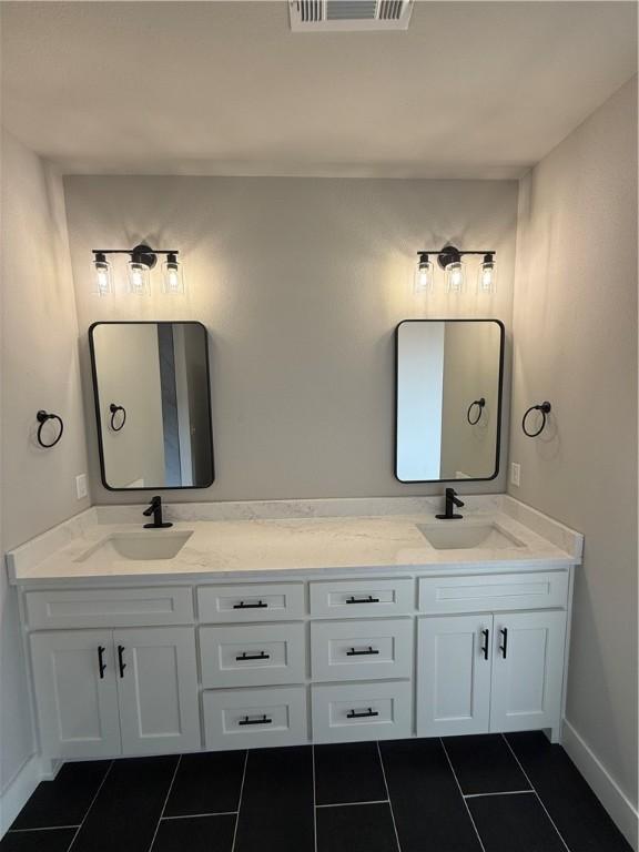 bathroom featuring vanity and tile patterned flooring