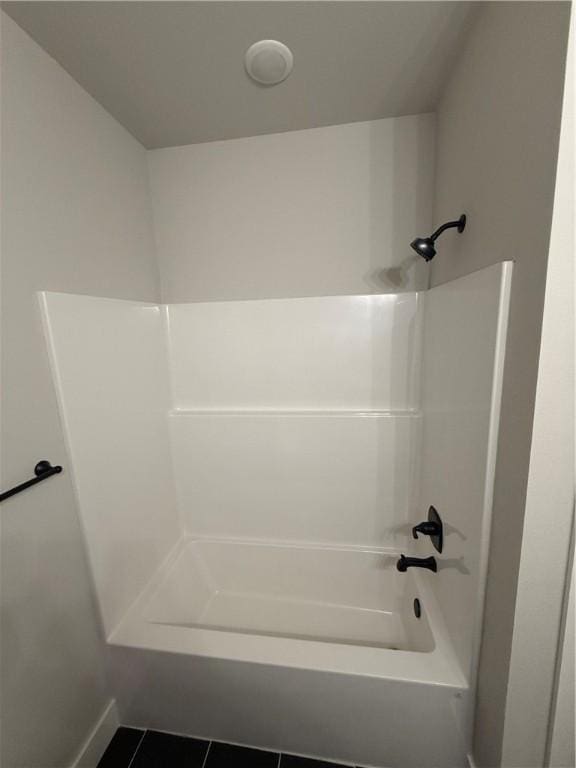 bathroom featuring shower / tub combination and tile patterned floors