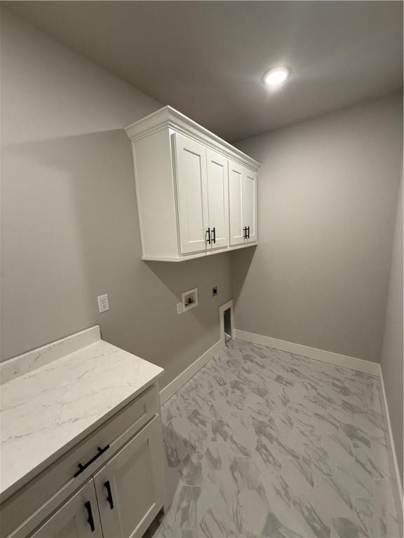 laundry room featuring cabinets, washer hookup, and electric dryer hookup