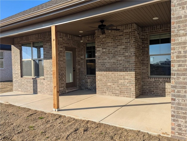 doorway to property with a patio and ceiling fan