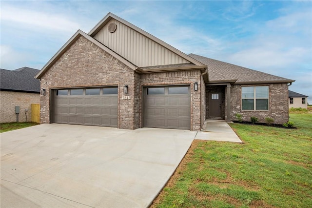 7843 Range Ave, Springdale, AR 72762 - view of front facade featuring board and batten siding, an attached garage, concrete driveway, brick siding, and a front yard
