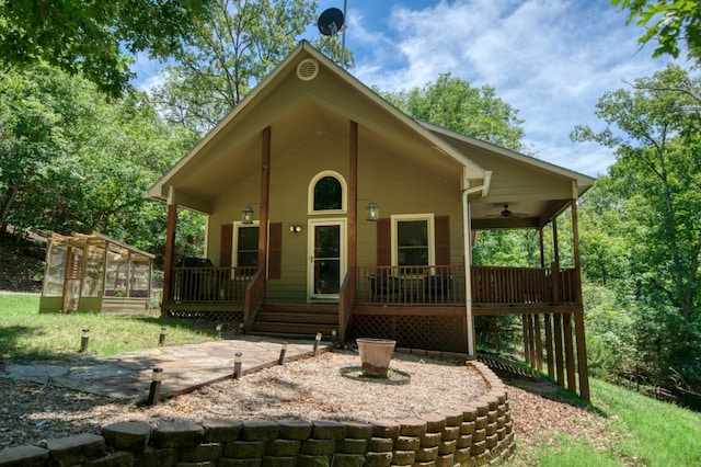 exterior space with ceiling fan