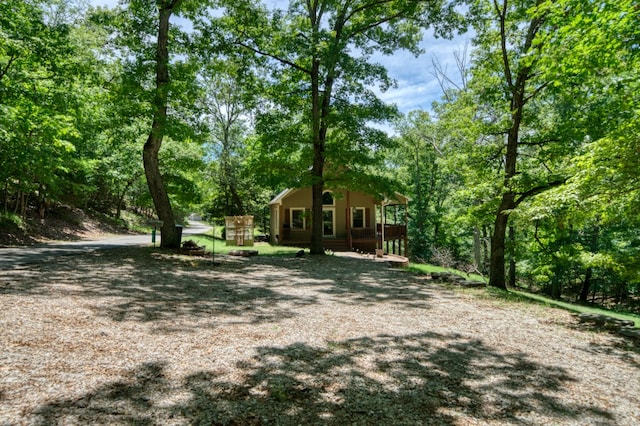 view of yard featuring covered porch