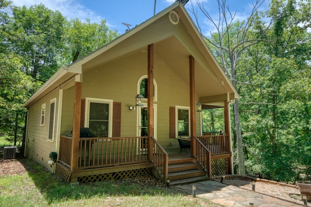 bungalow-style house with a porch and cooling unit