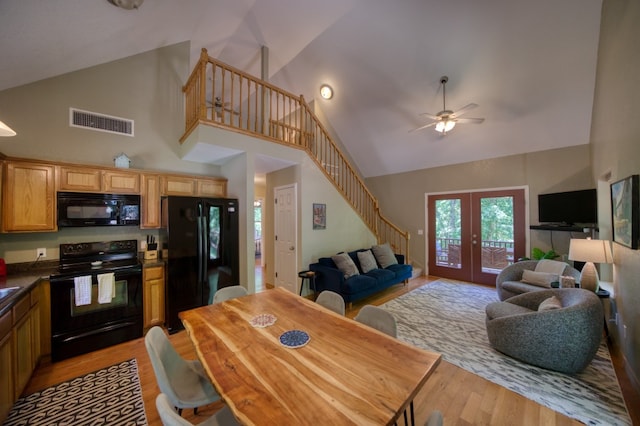 kitchen featuring light hardwood / wood-style floors, black appliances, ceiling fan, and high vaulted ceiling