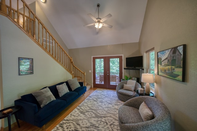 living room featuring wood-type flooring, french doors, high vaulted ceiling, and ceiling fan