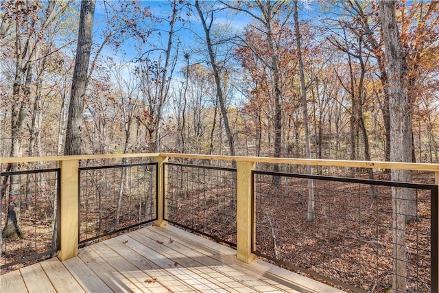 wooden deck featuring a wooded view