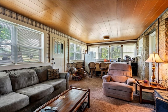 sunroom featuring plenty of natural light and wooden ceiling