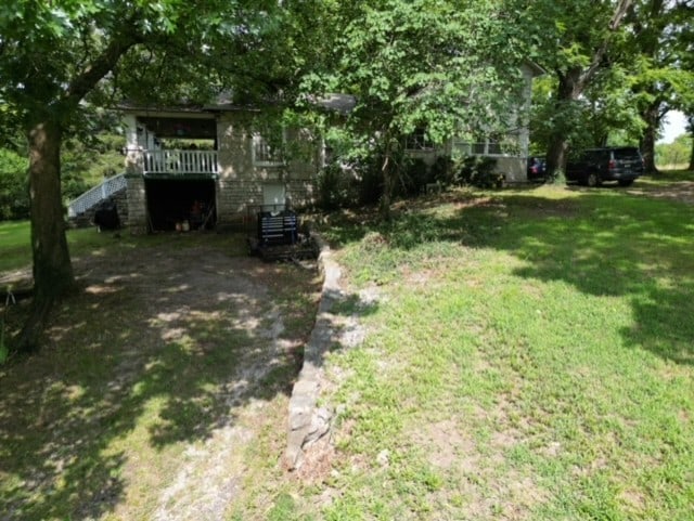 view of yard with a wooden deck