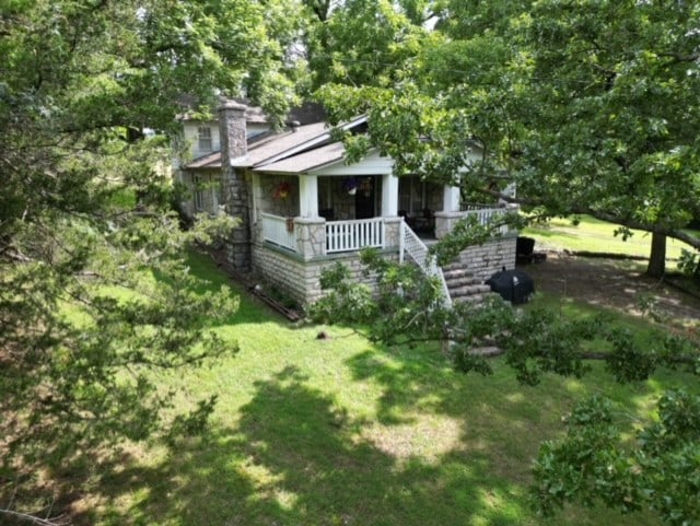 view of front of house featuring a front lawn and a porch