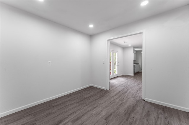 unfurnished room featuring dark hardwood / wood-style floors