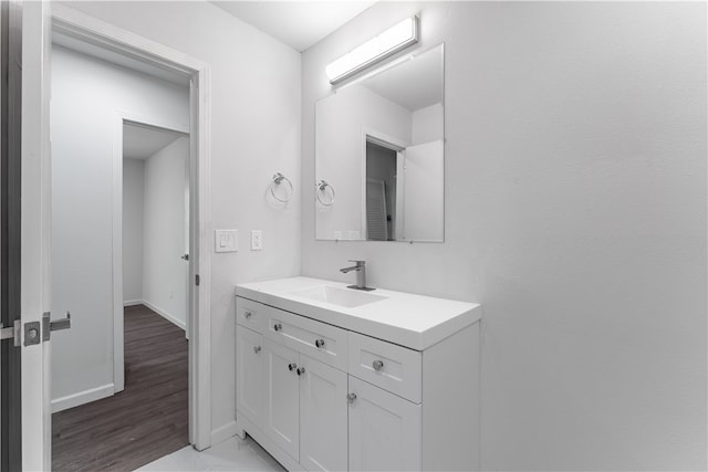 bathroom featuring hardwood / wood-style flooring and vanity