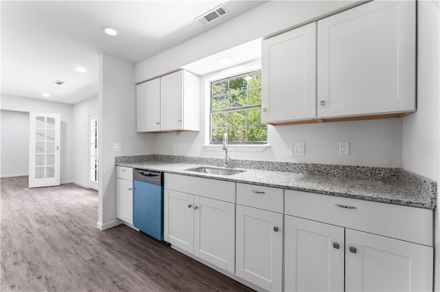 kitchen with white cabinets, dishwasher, stone counters, dark hardwood / wood-style floors, and sink