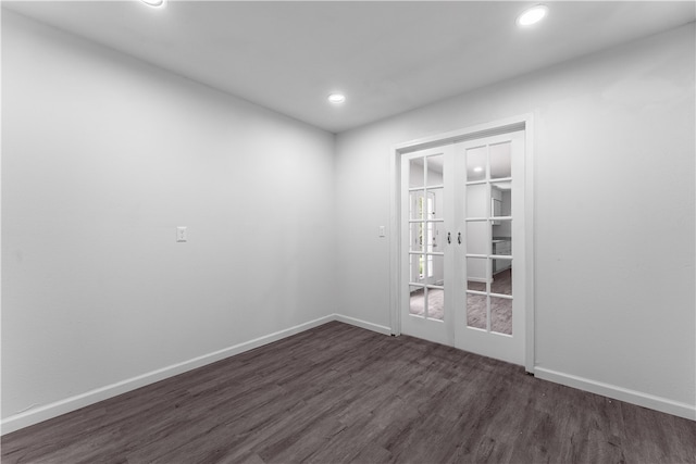 unfurnished room featuring dark hardwood / wood-style floors and french doors