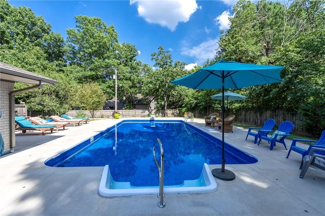 view of pool with a fenced in pool, a patio area, and a fenced backyard