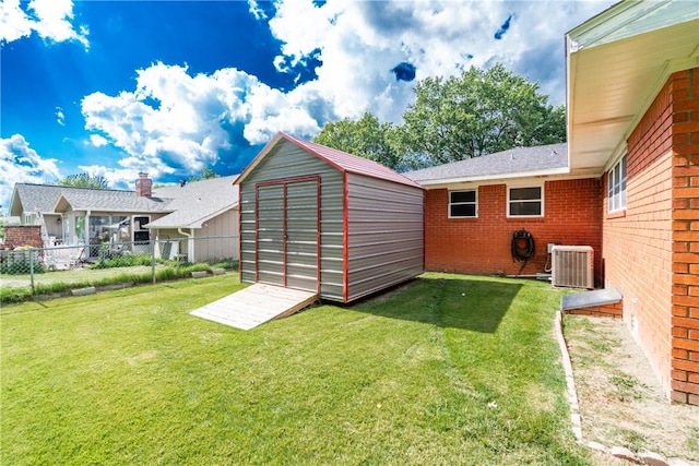 view of yard with a shed and cooling unit