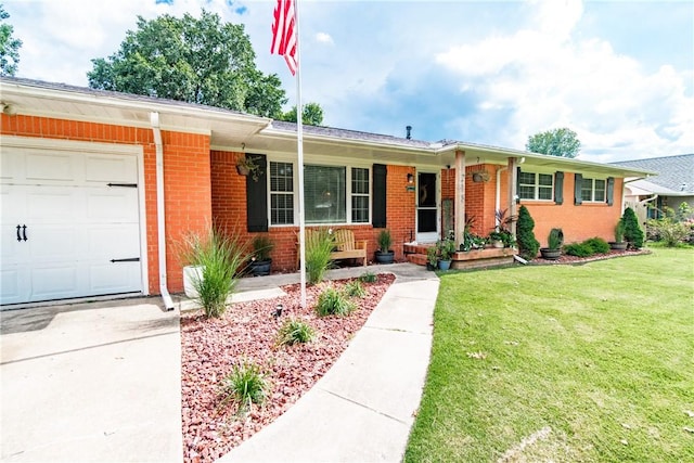 ranch-style house featuring covered porch, a front yard, and a garage