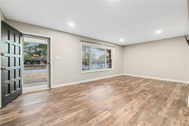 interior space with hardwood / wood-style flooring and plenty of natural light