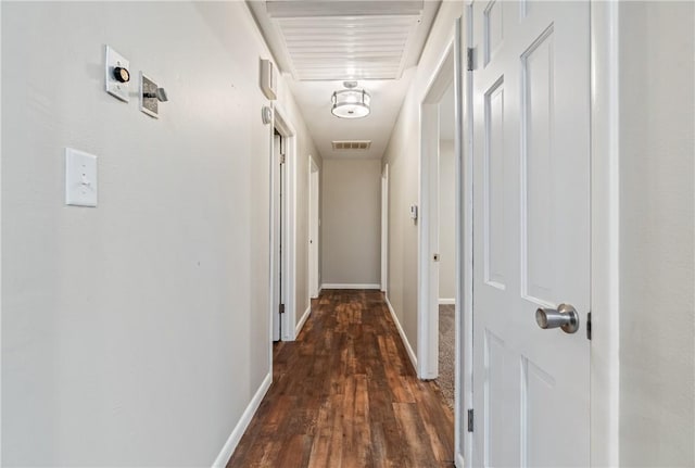 hall with dark hardwood / wood-style flooring