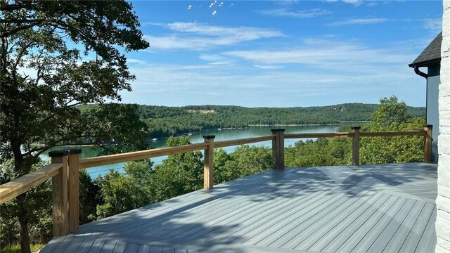 wooden deck with a water view