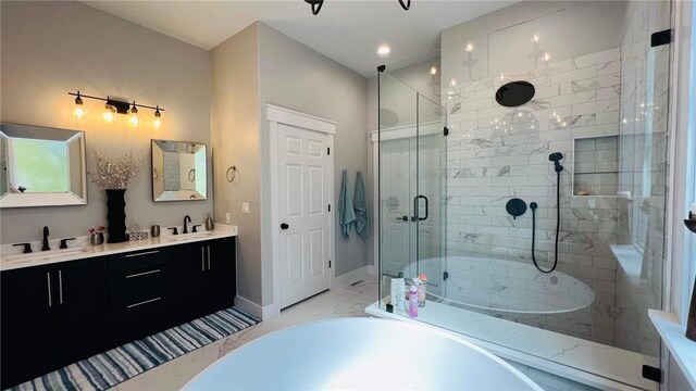 bathroom with separate shower and tub, tile patterned floors, and dual bowl vanity