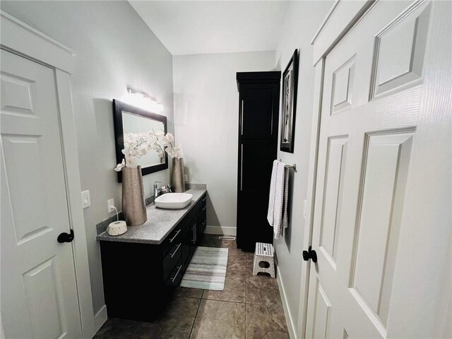 bathroom featuring vanity and tile patterned flooring