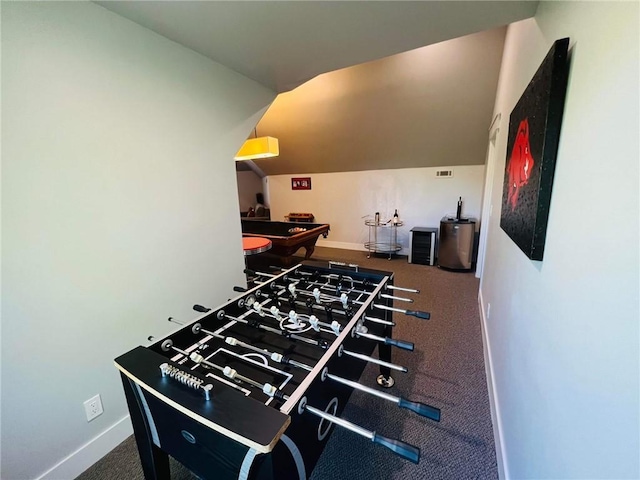 rec room with vaulted ceiling and baseboards