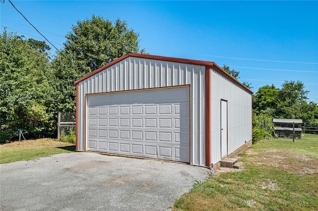 garage featuring a lawn